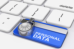 a blue button on a white keyboard with text stating “personal data” with a lock image on top of the blue button.