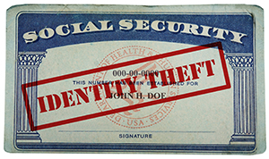 A Social Security Card with red text overlaying the card stating “Identity Theft”